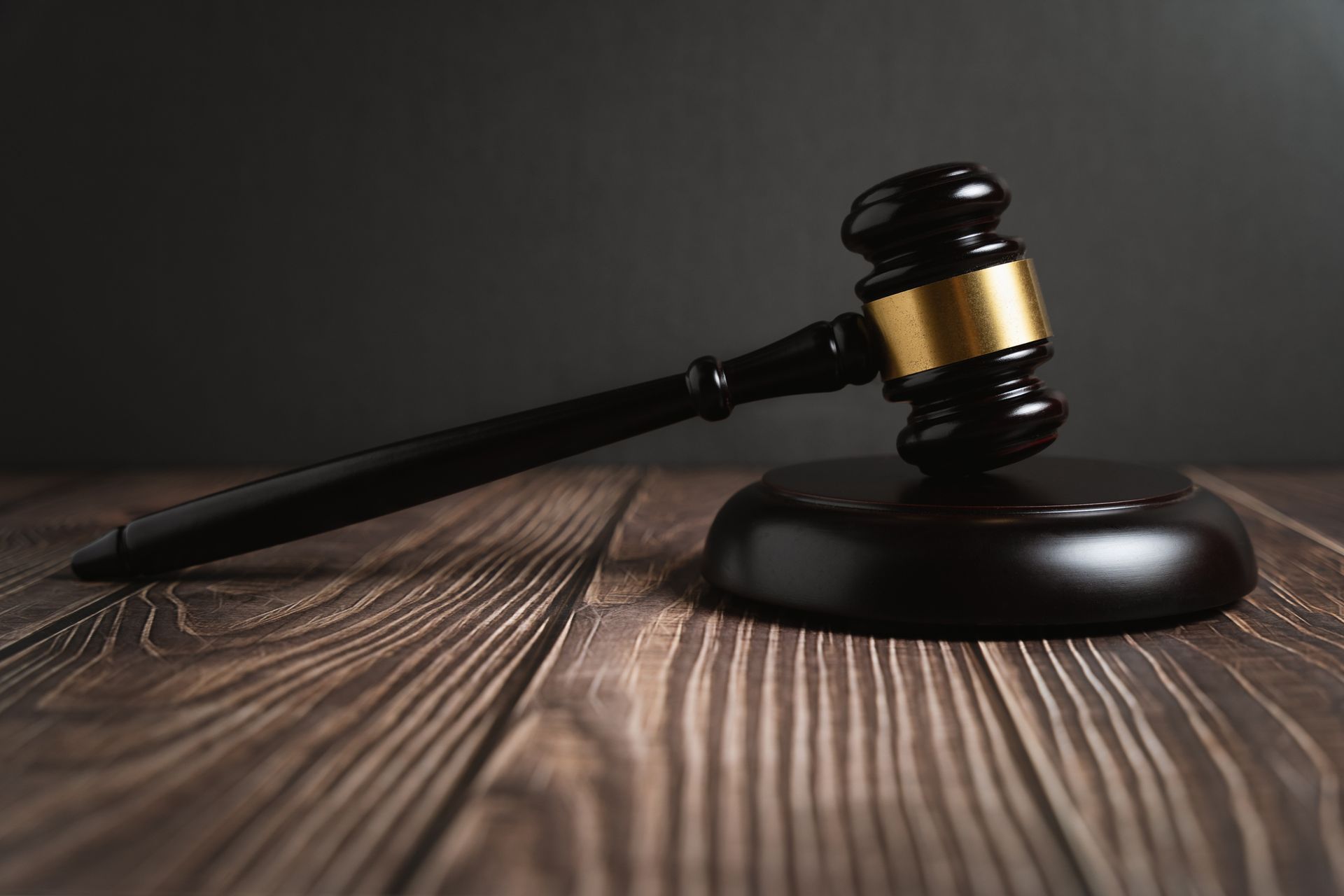 Wooden Gavel and Metal Handcuffs — Birmingham, AL — Magic City Investigations, LLC Wooden Gavel and Metal Handcuffs — Birmingham, AL — Magic City Investigations, LLC