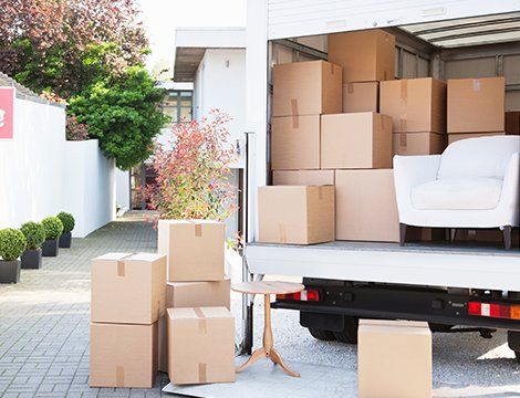 Moving Out Items From Company Truck — Residential Moving Services in Niles, OH