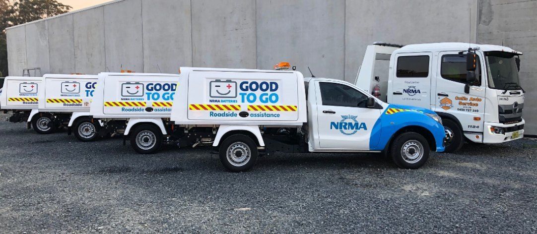 Three Trucks Are Parked Next to Each Other in a Parking Lot — Coffs Auto Service in North Boambee Valley, NSW