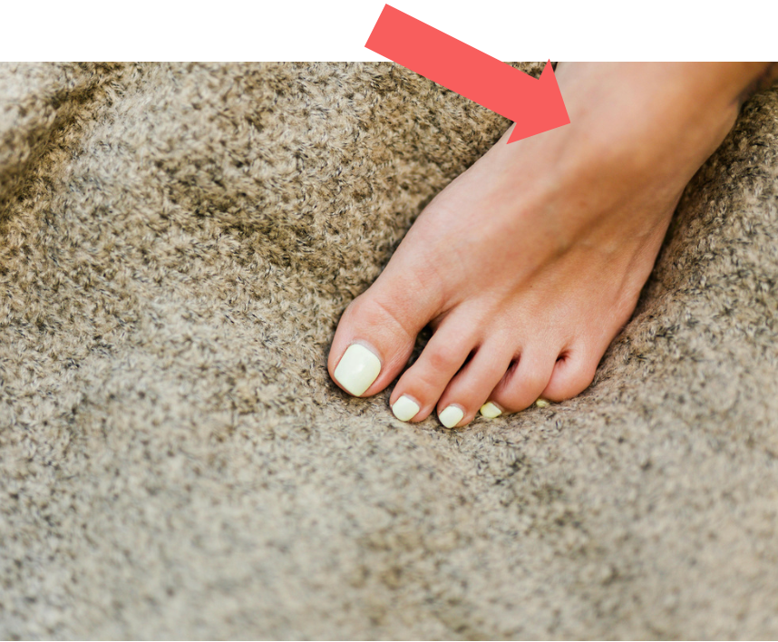 A close up of a skeleton of a foot on a black background.
