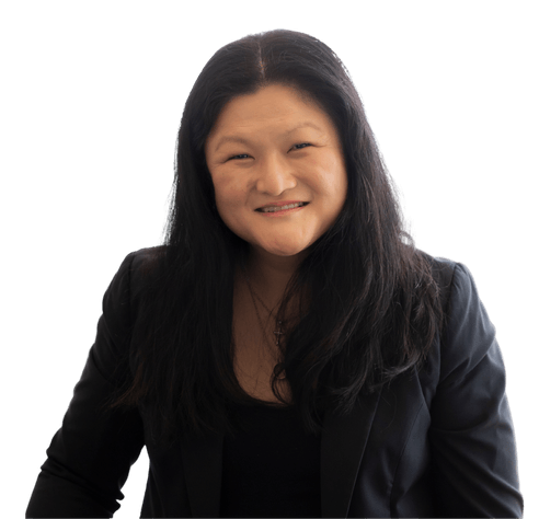 A woman with long black hair is smiling and wearing a black jacket