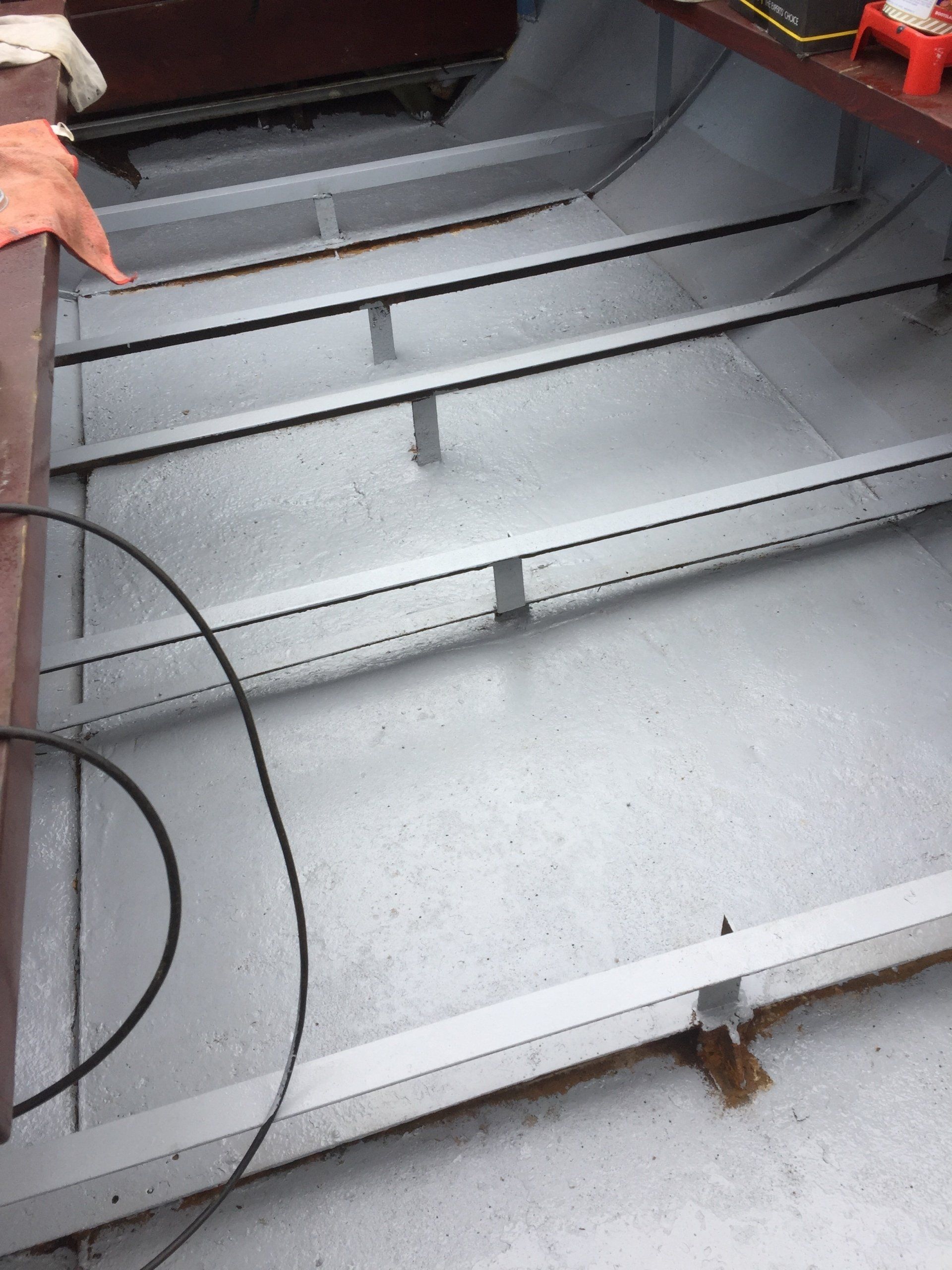 bottom of a boat cleaned and painted