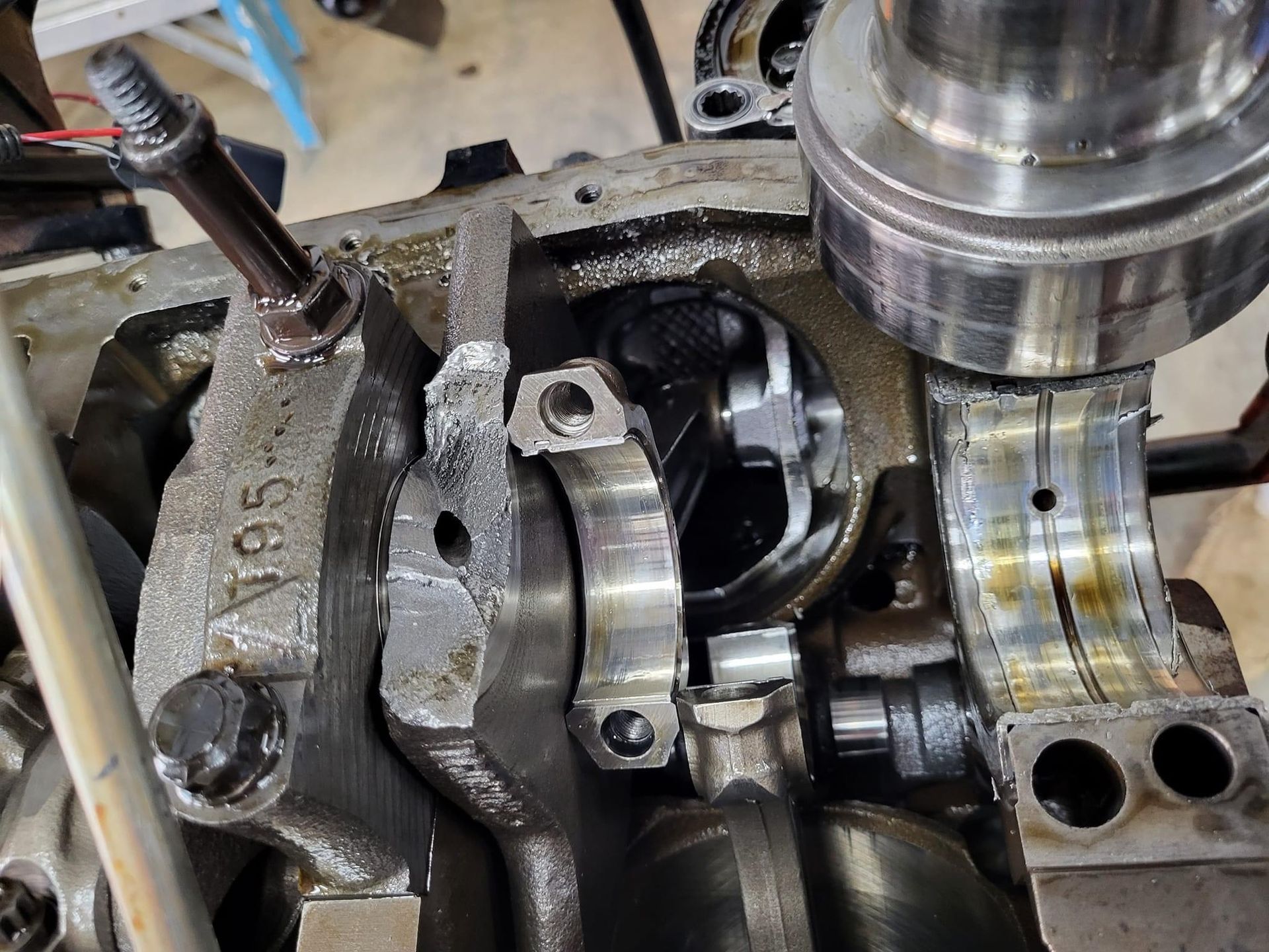 a boat engine bottom end dismantled and crankshaft removed