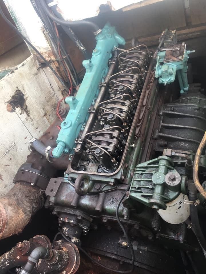 a boat engine with rocker cover removed