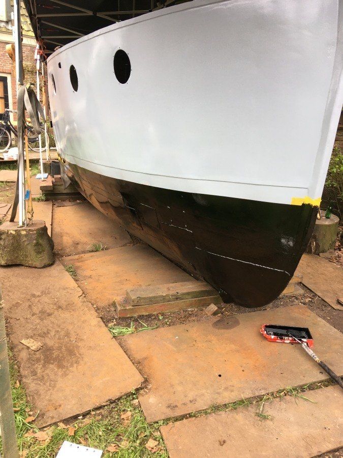 a boat named Michiel de Ruyter being restored in dry dock