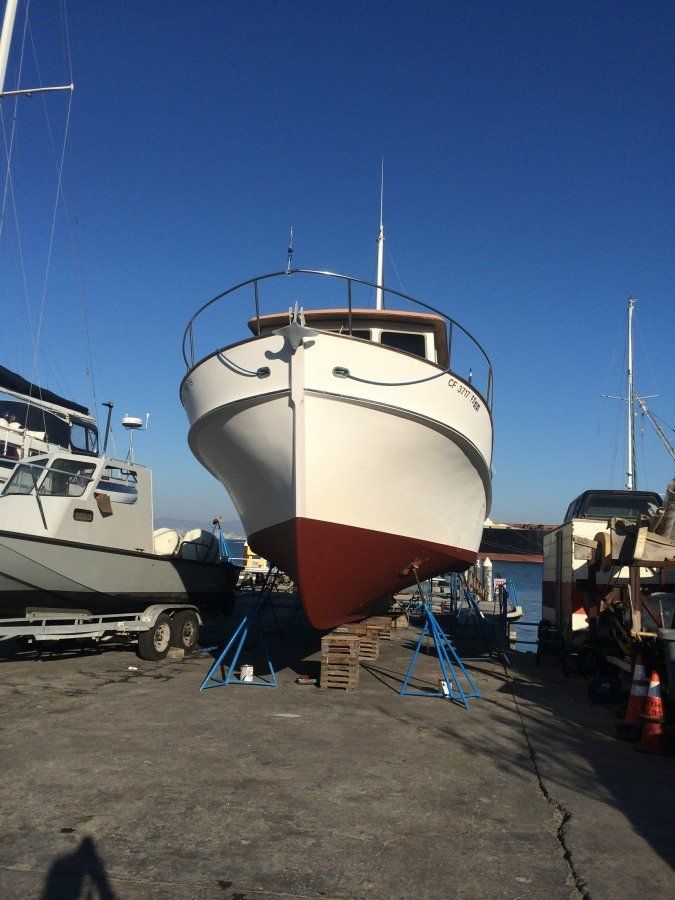 small yacht hauled out of the water
