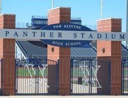 Van Alstyne Panther Stadium entrance with brick columns, a blue sign, and a gate.