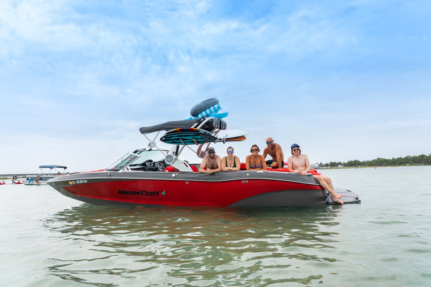 Group of people riding in red powerboat