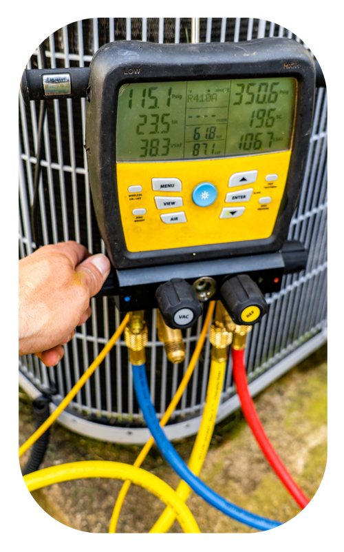 A person is using a digital thermometer to check the temperature of an air conditioner