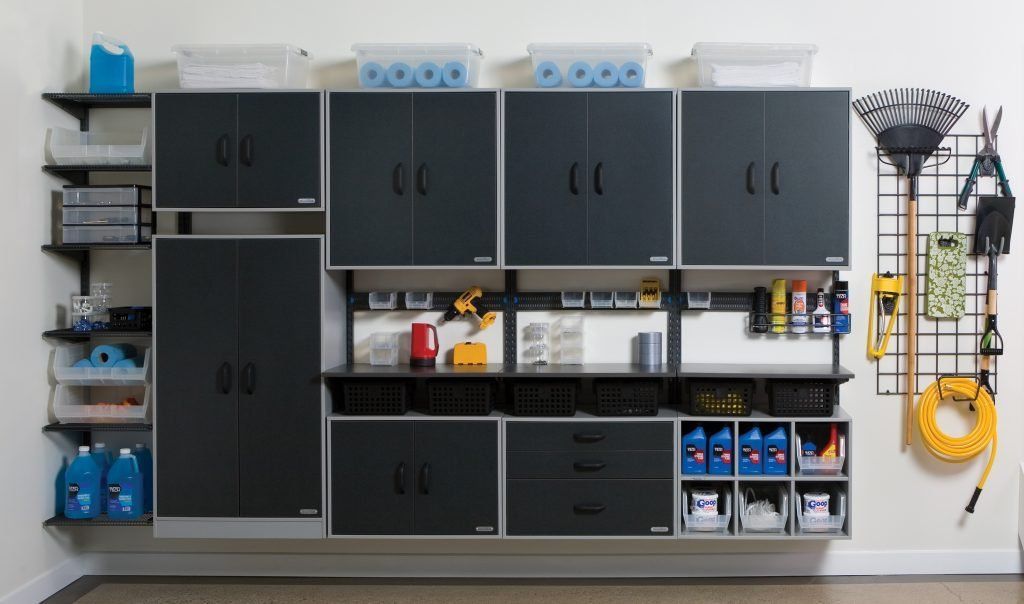 A garage filled with lots of cabinets and shelves