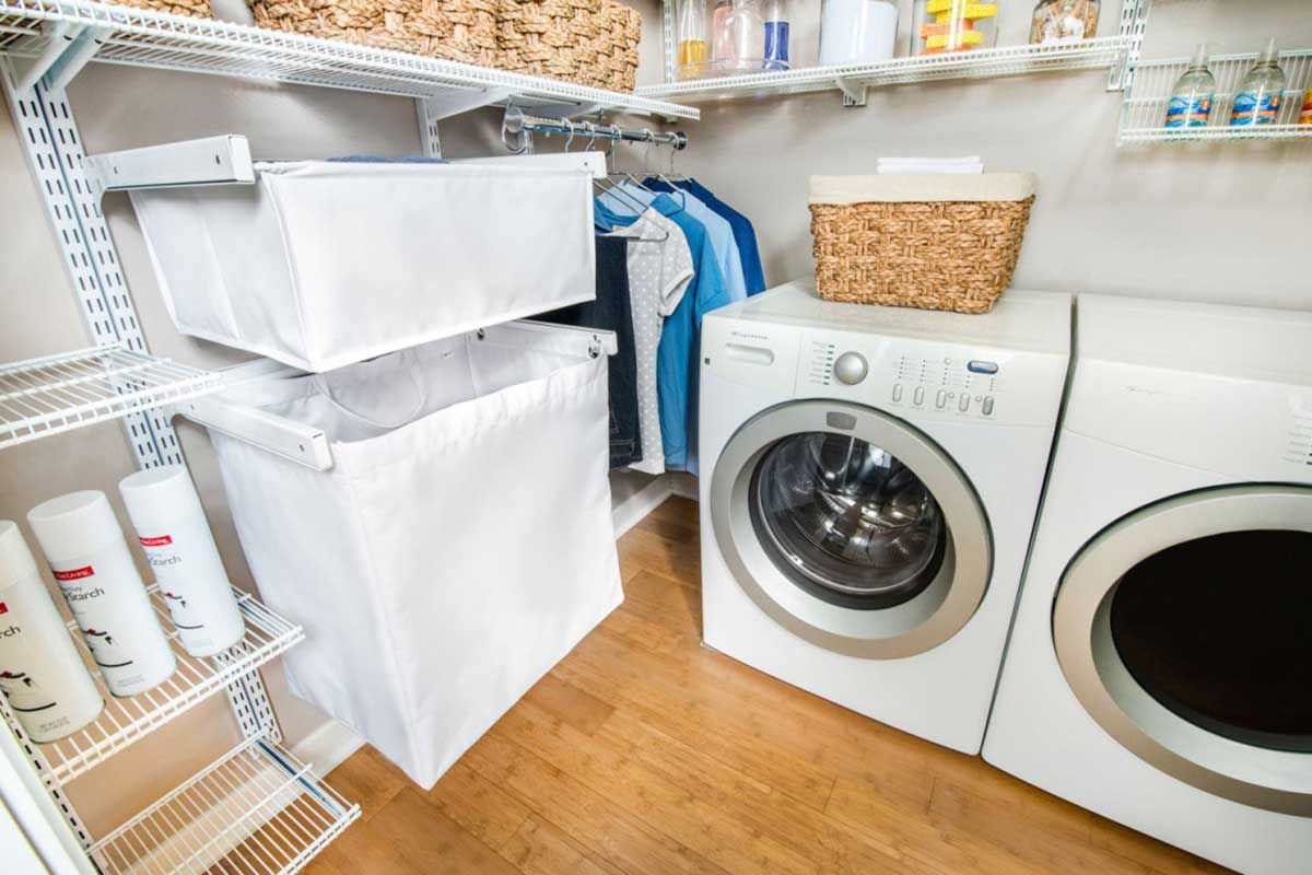 A laundry room with a washer and dryer and a laundry basket.