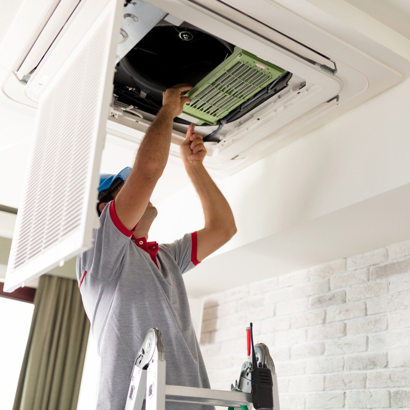 Man Repairing Air Condition — Hyattsville, MD — Nero’s Heating And Air