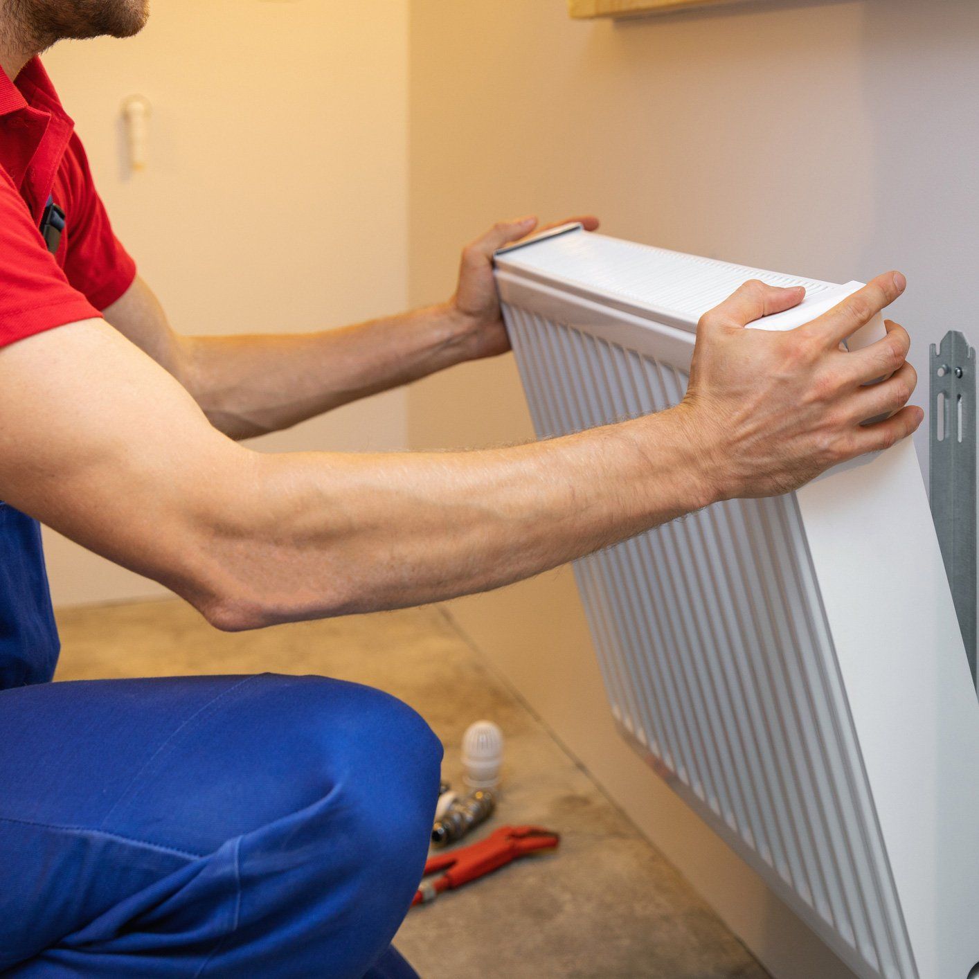 Man Installing New Repair Heater — Hyattsville, MD — Nero’s Heating And Air