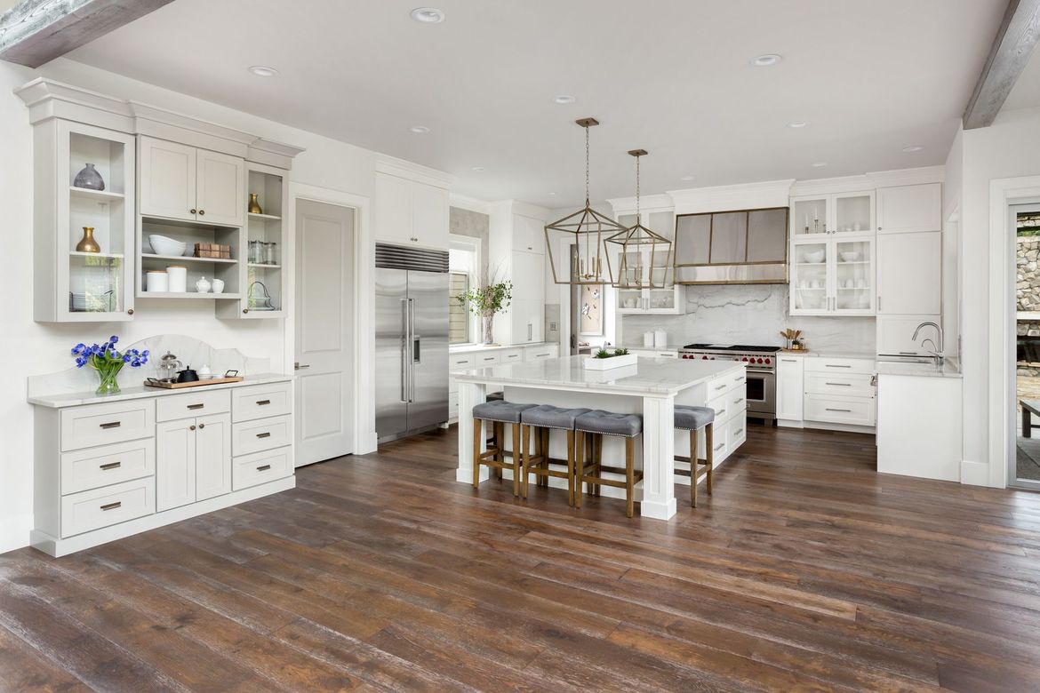 A Large Kitchen with White Cabinets and Hardwood Floors | Galloway, OH | L & L Hardwood Floors