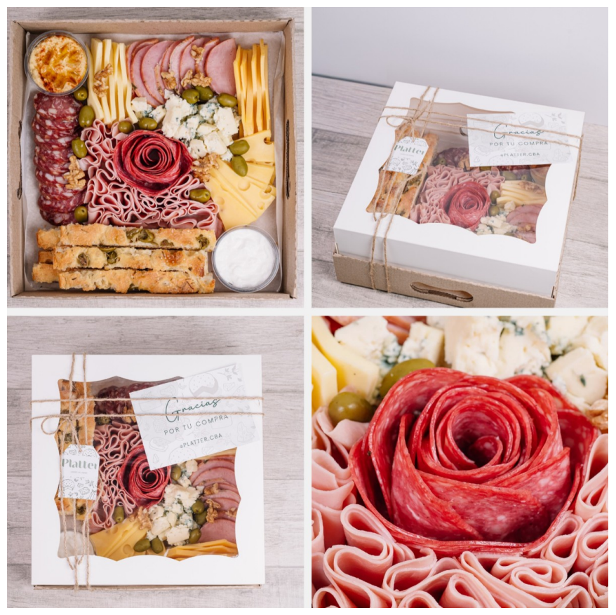 Cajas de charcutería con quesos, carnes, galletas y aceitunas. Algunas vienen en caja, otras con cordel y una rosa de salami.