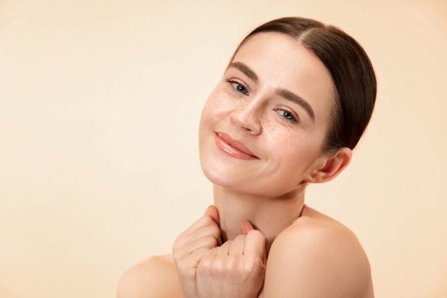 Smiling Woman With Bare Shoulders — A9 Skin and Hair Clinic in Westmead, NSW
