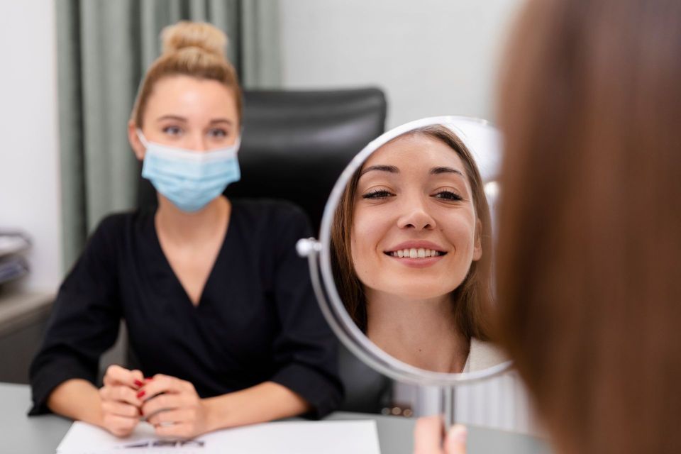 Masked Dentist Smiling in a Mirror — A9 Skin and Hair Clinic in Westmead, NSW