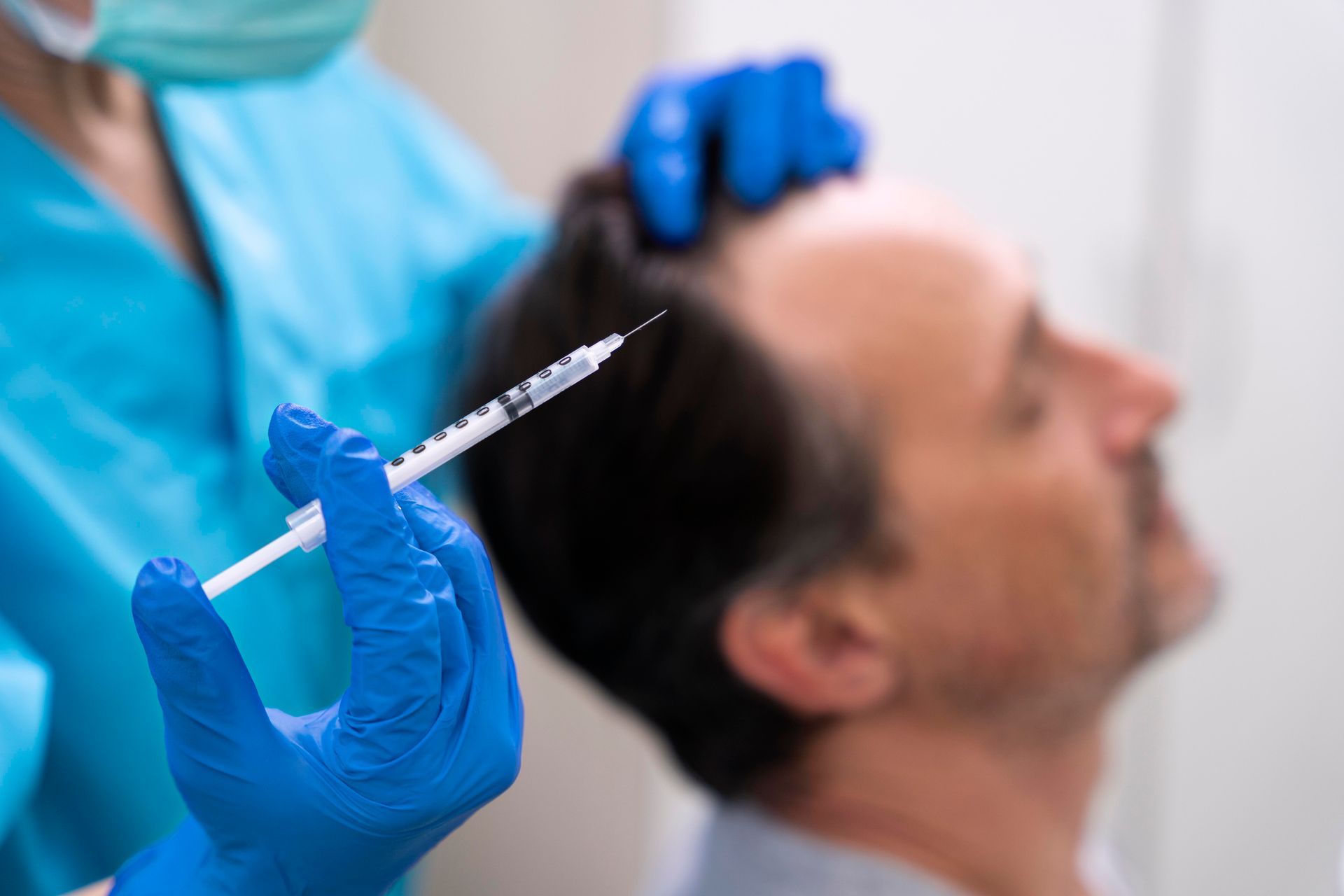 Healthcare Worker in Blue Gloves Preparing an Injection — A9 Skin and Hair Clinic in Westmead, NSW