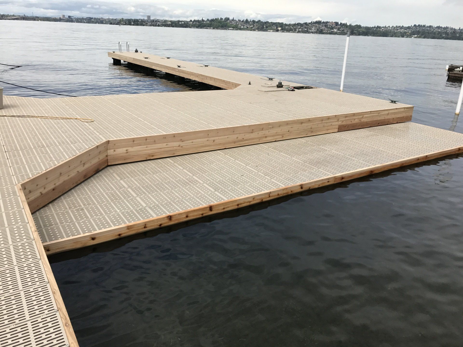 A wooden dock in the middle of a body of water