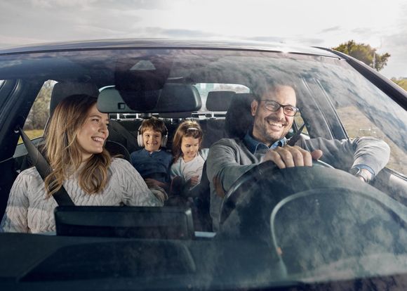 Happy Family In Car — Hillsboro, TX — Lehmann Insurance Agency