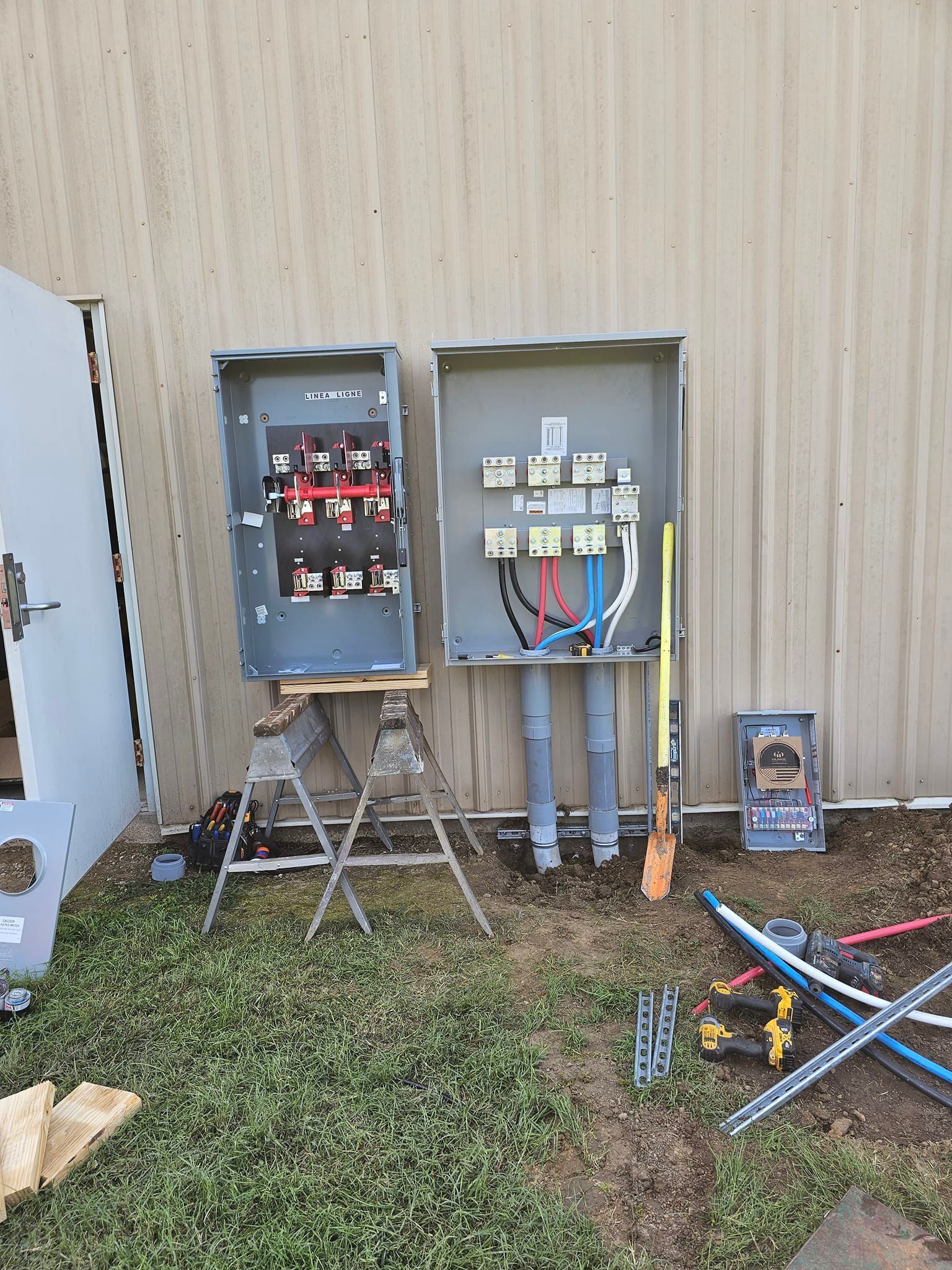 Woman in straw hat smiles, holding wine glass near a lake.