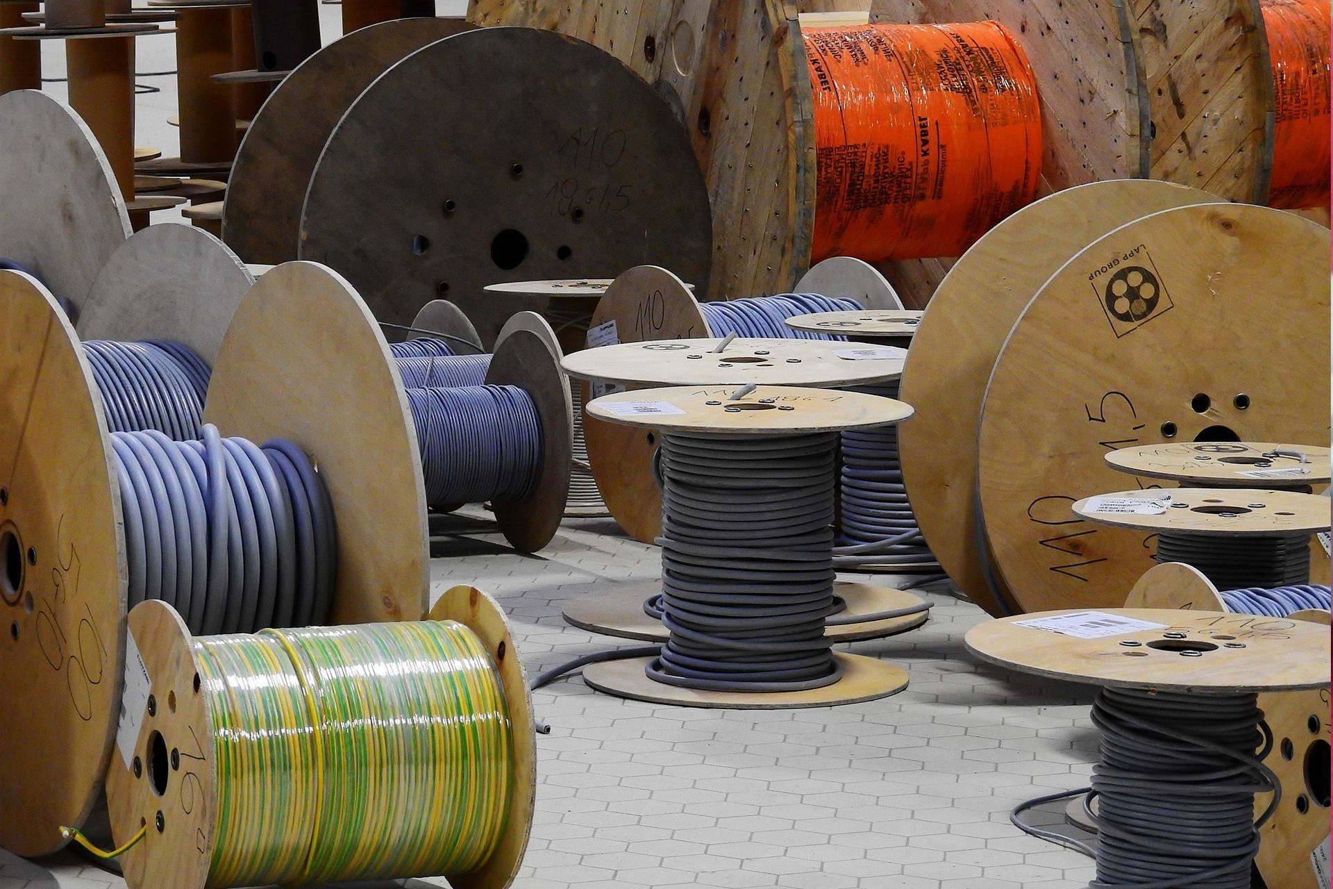A bunch of spools of wires are sitting on the ground