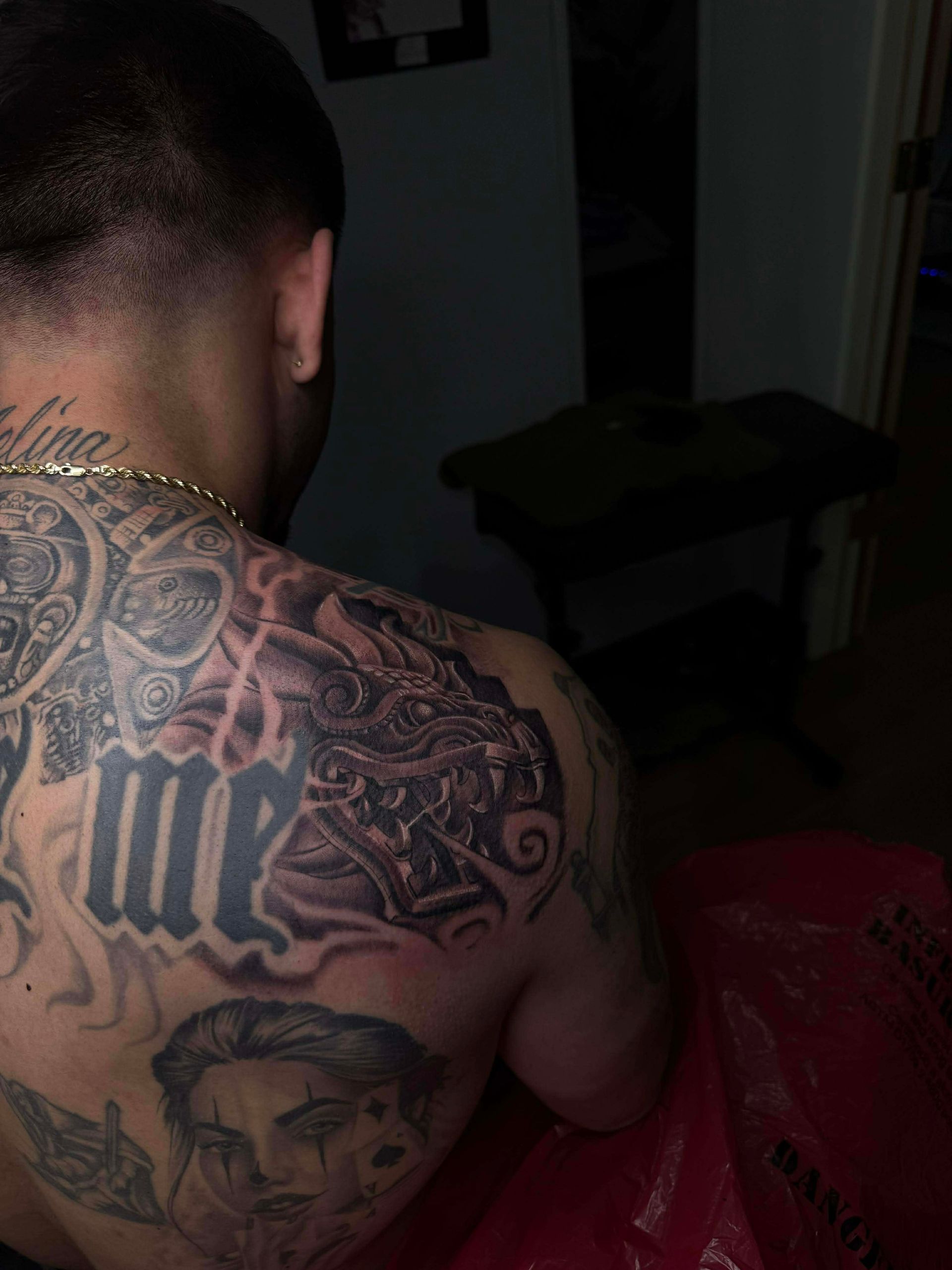 Back tattoo with intricate dragon design,