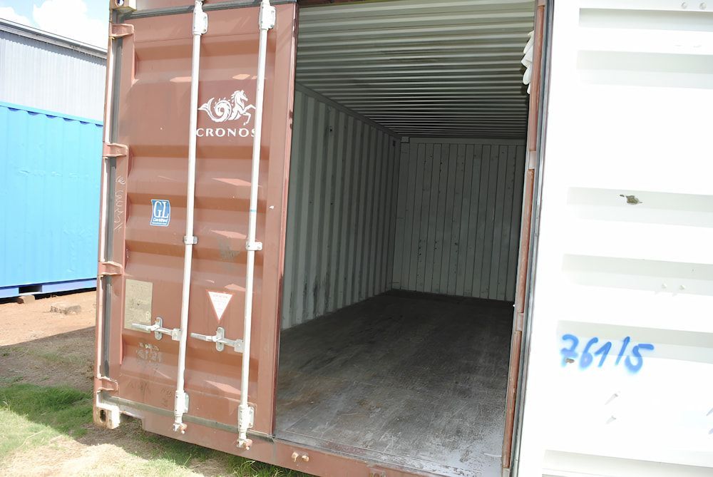 A Brown And White Shipping Container With The Door Open — Ollies Towing & Shipping Container Sales in Kingaroy, QLD