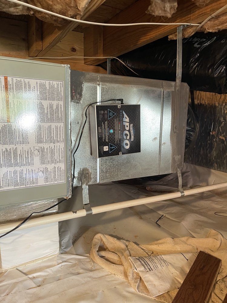 A picture of an air conditioner in a basement.