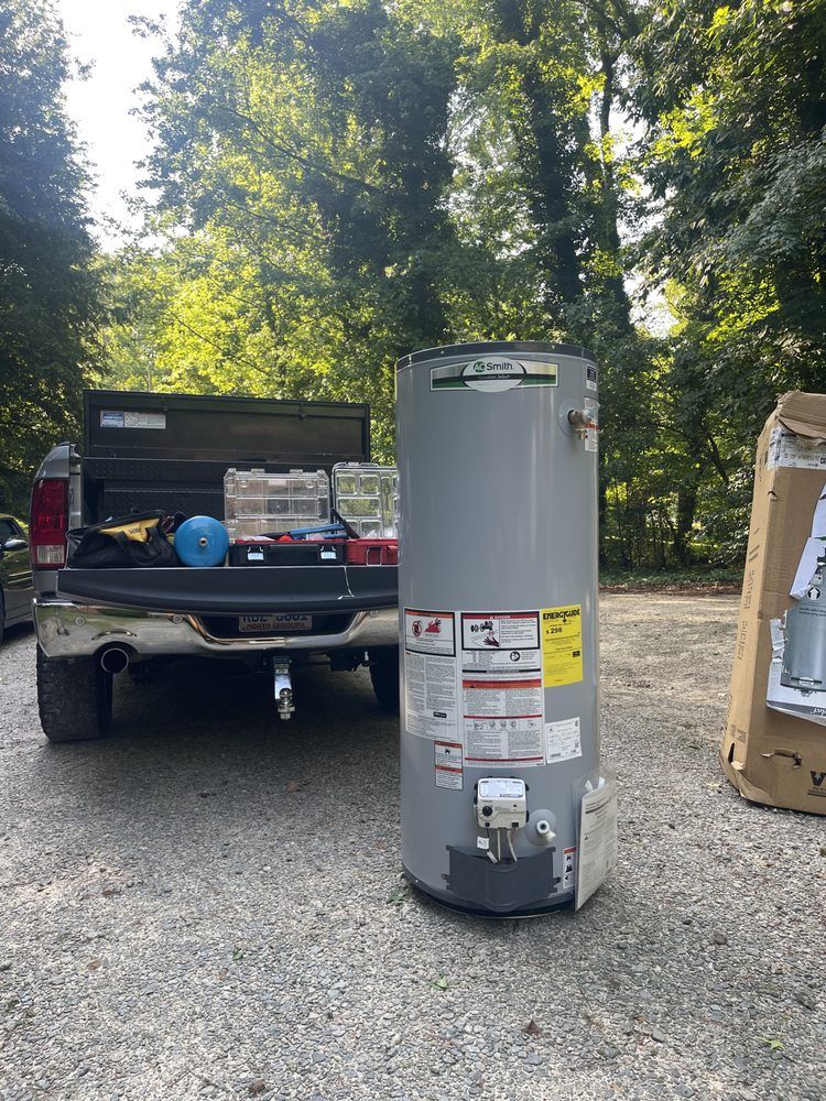 A water heater is sitting in the back of a truck.