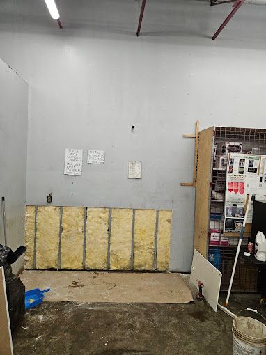 A room with a large piece of insulation on the wall.