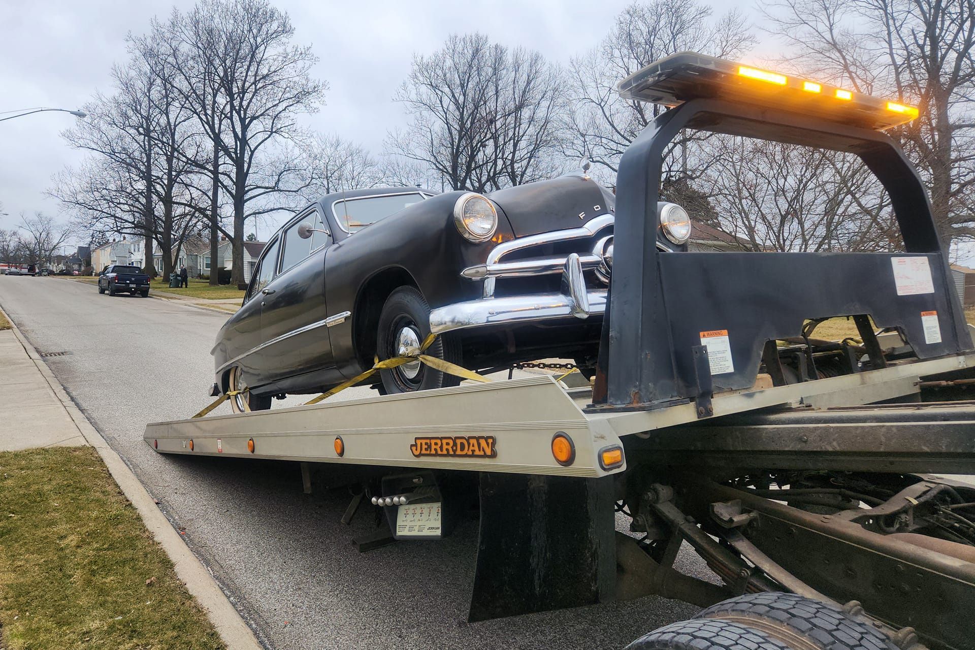 Old Ford Car on Towing Truck