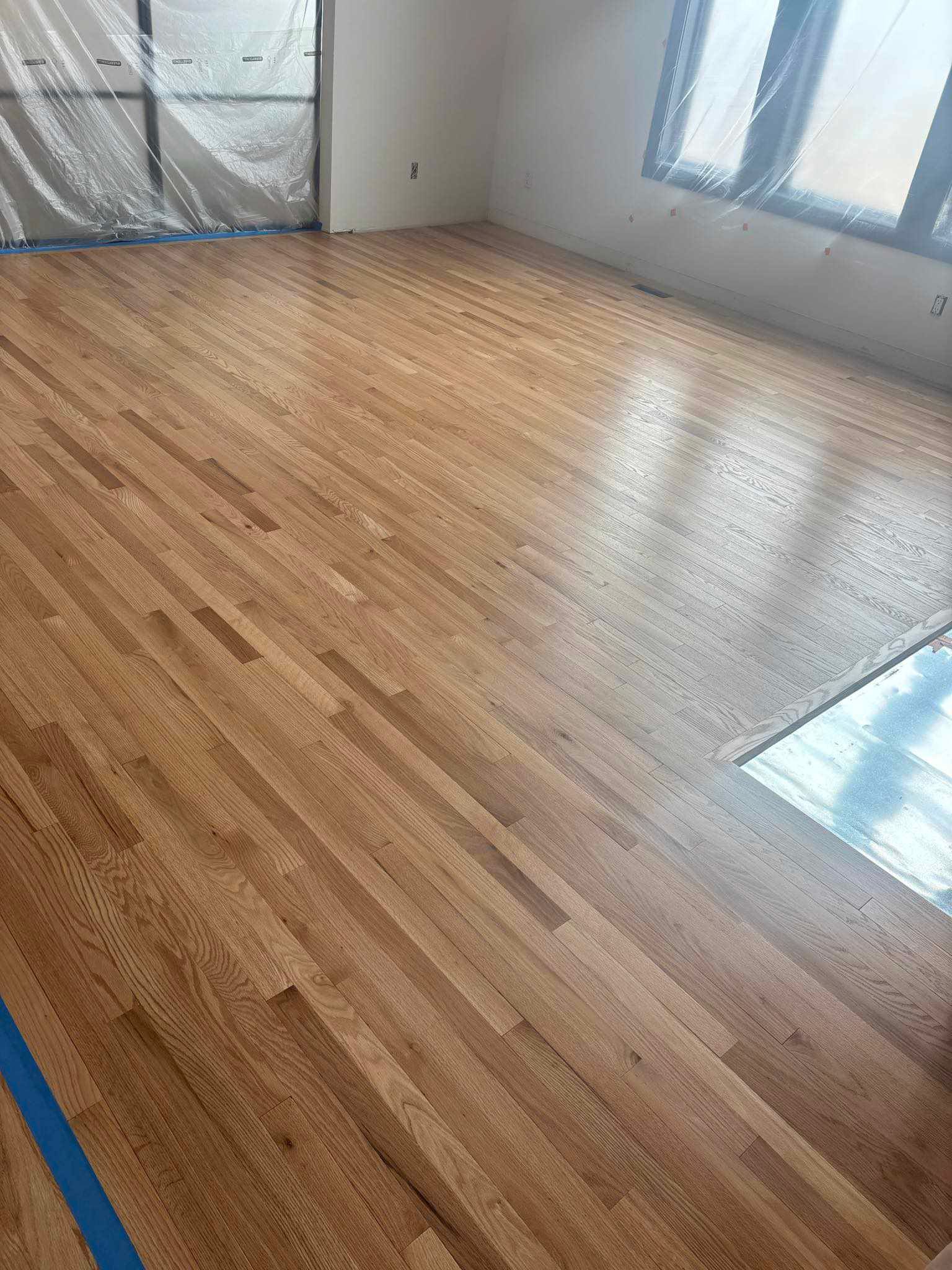 Picture of a hardwood floor in a living room. 