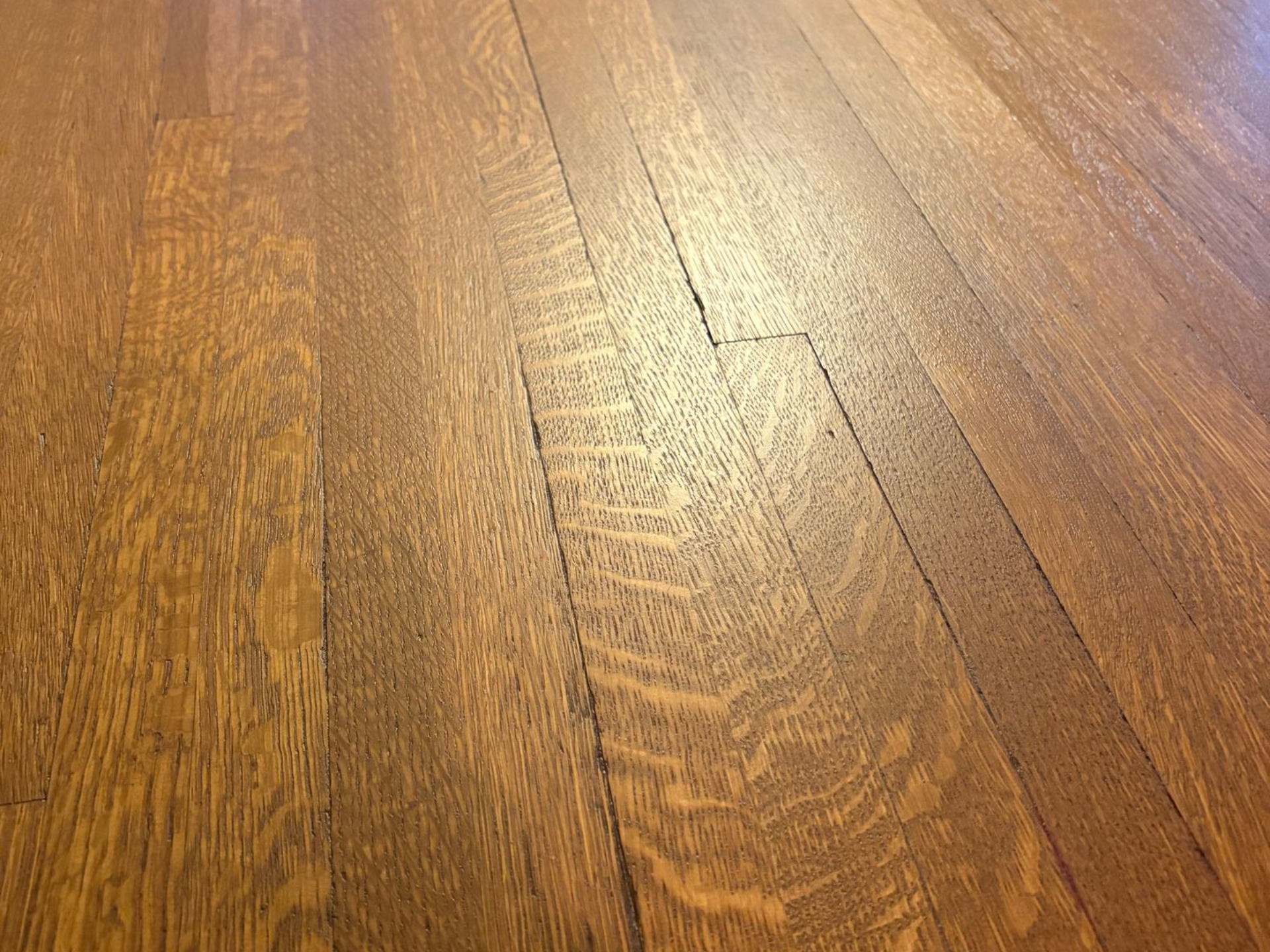 Image of a wood floor refinished by InfinityFlooring a wood floor refinishing company in Sioux City, Iowa.