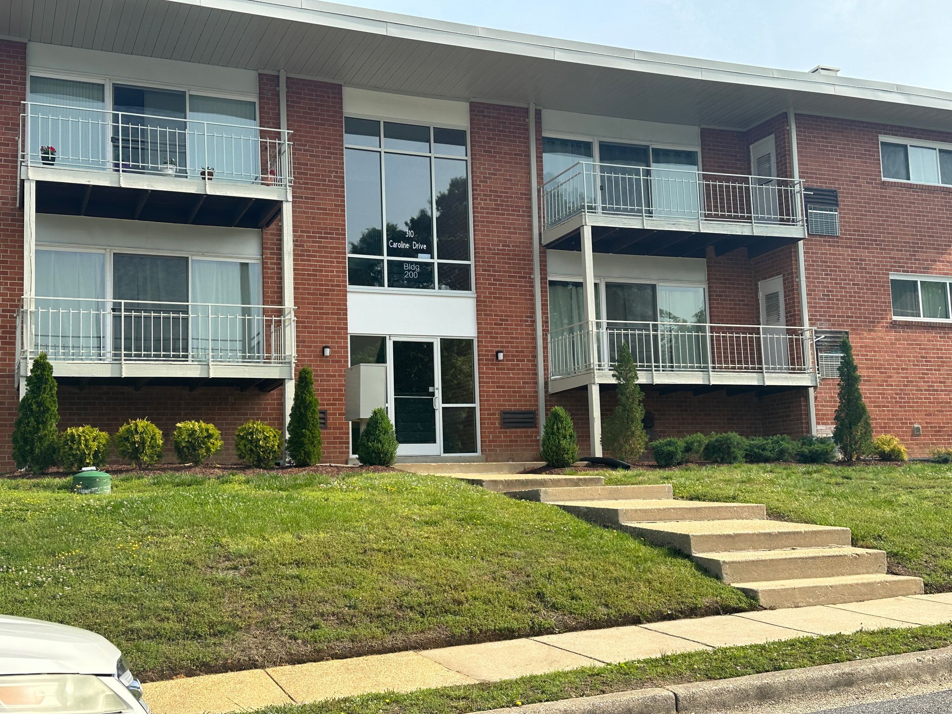 A large brick apartment building with a lot of windows and balconies.
