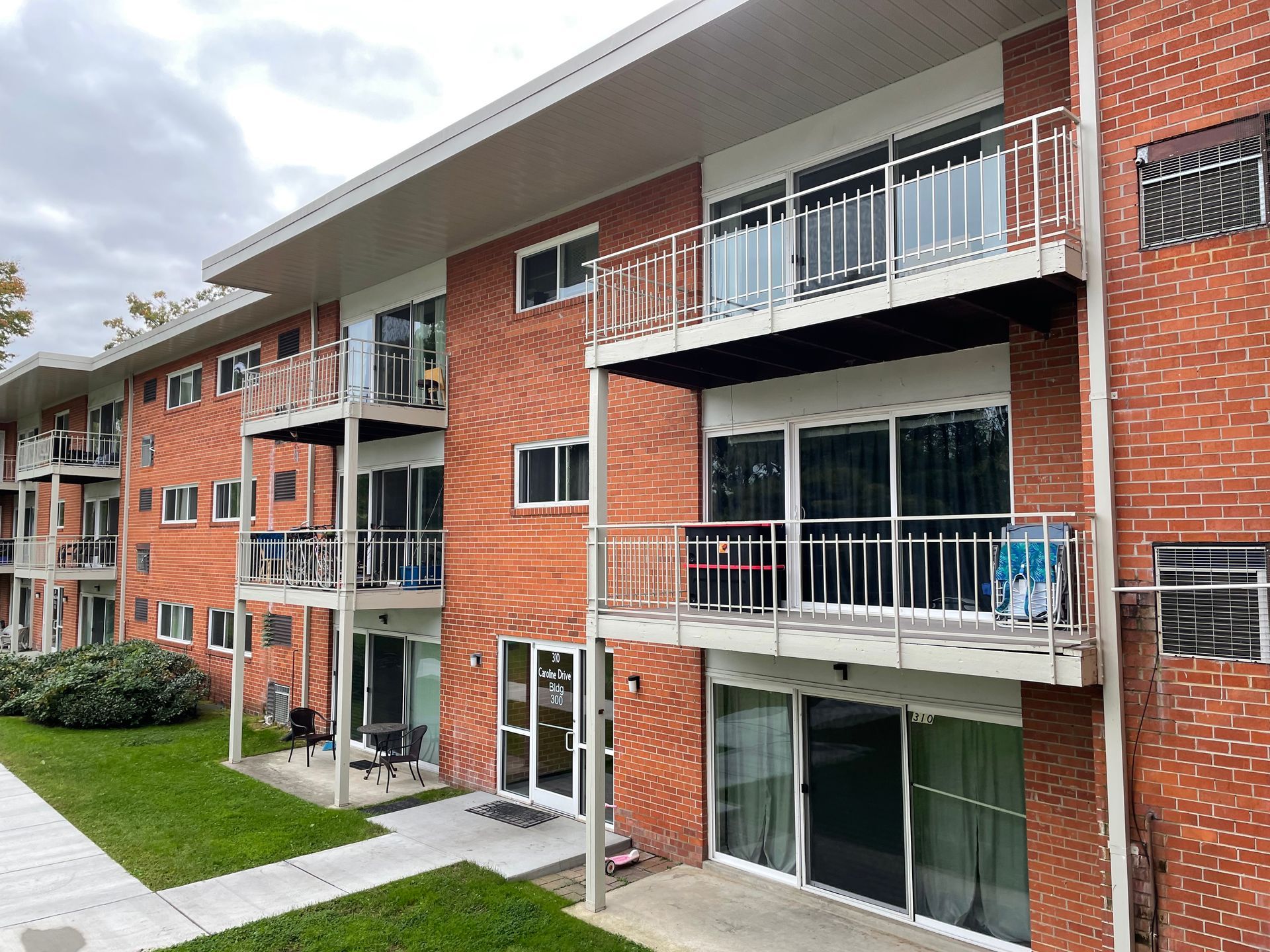 A large brick building with a lot of windows and balconies.