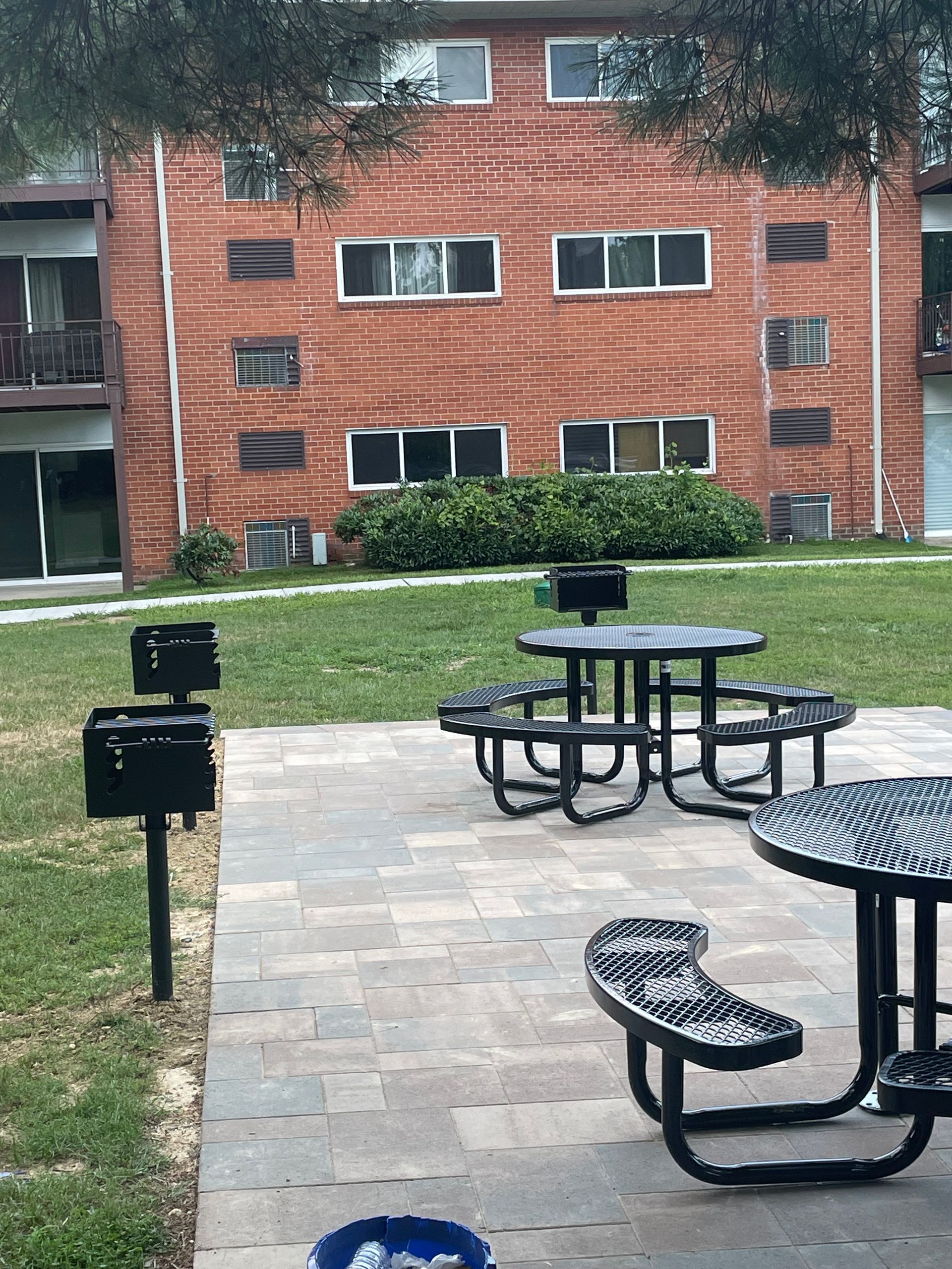 A brick building with a picnic table in front of it