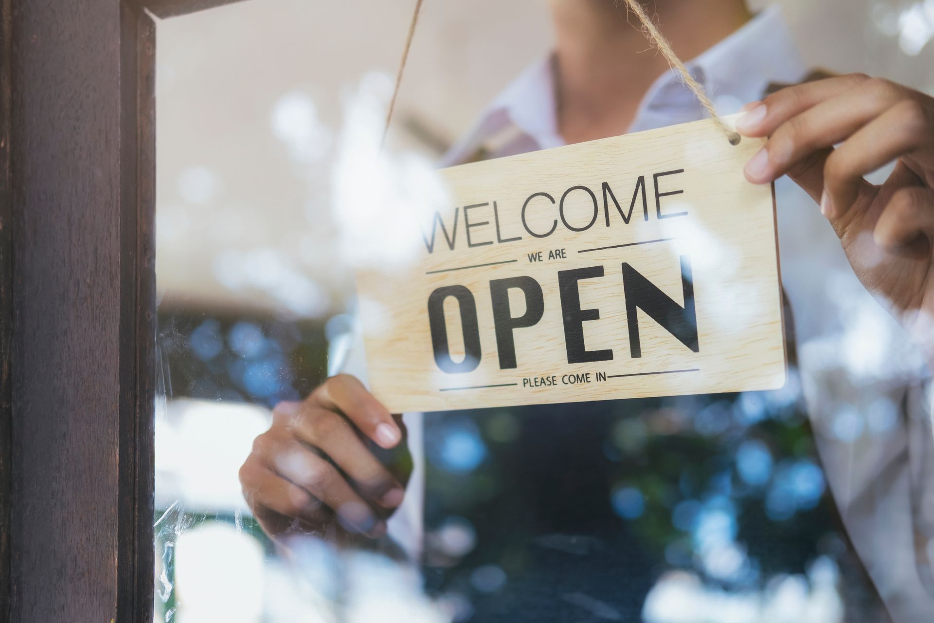 Photograph of a business owner placing a 