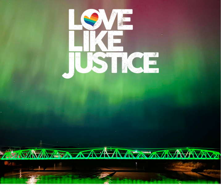 Love Like Justice Lights over an aurora behind the bell street bridge