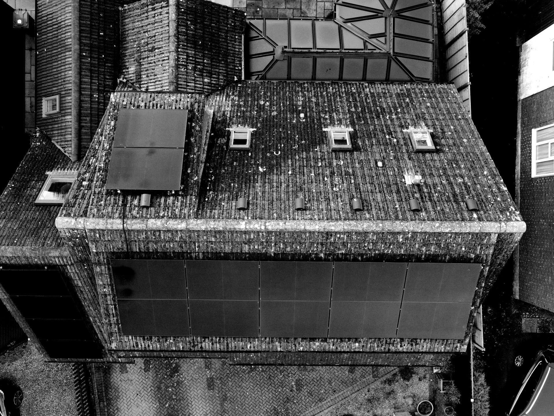 An aerial view of a house with a tiled roof.