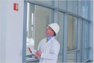 Inspecting Fire Alarm - Inspection of Fire Protection Equipment in Northern New England
