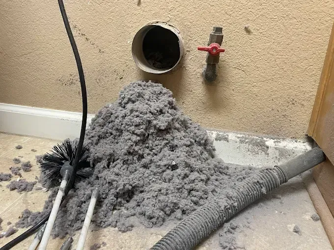 Before and after of duct cleaning, a vacuum hose inside a dirty duct and a clean duct.