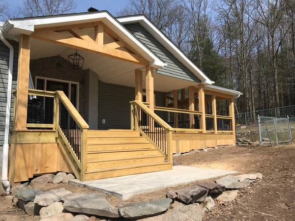 A house with a wooden porch and stairs