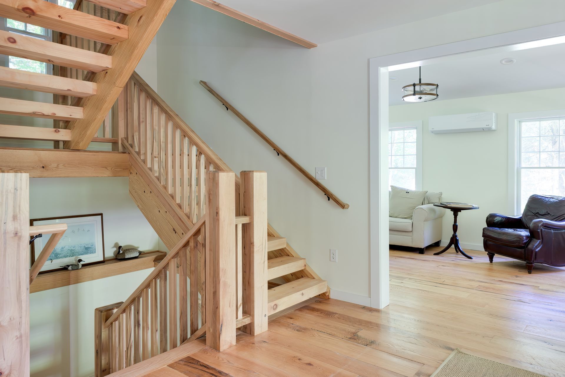 A wooden staircase leading up to the second floor of a house.