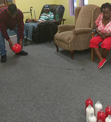 playing bowling in senior day care