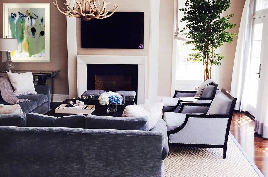 A living room filled with furniture and a fireplace
