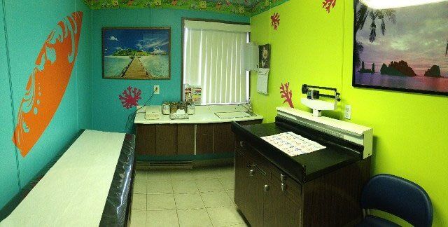 Doctor Checking Baby's Heartbeat — Toms River, NJ — Sunny Pediatrics, Inc.