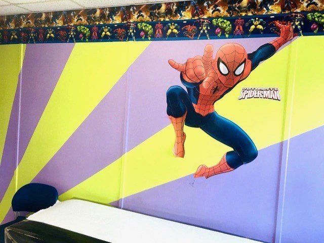 Examination Room With Spiderman Sticker — Toms River, NJ — Sunny Pediatrics, Inc.