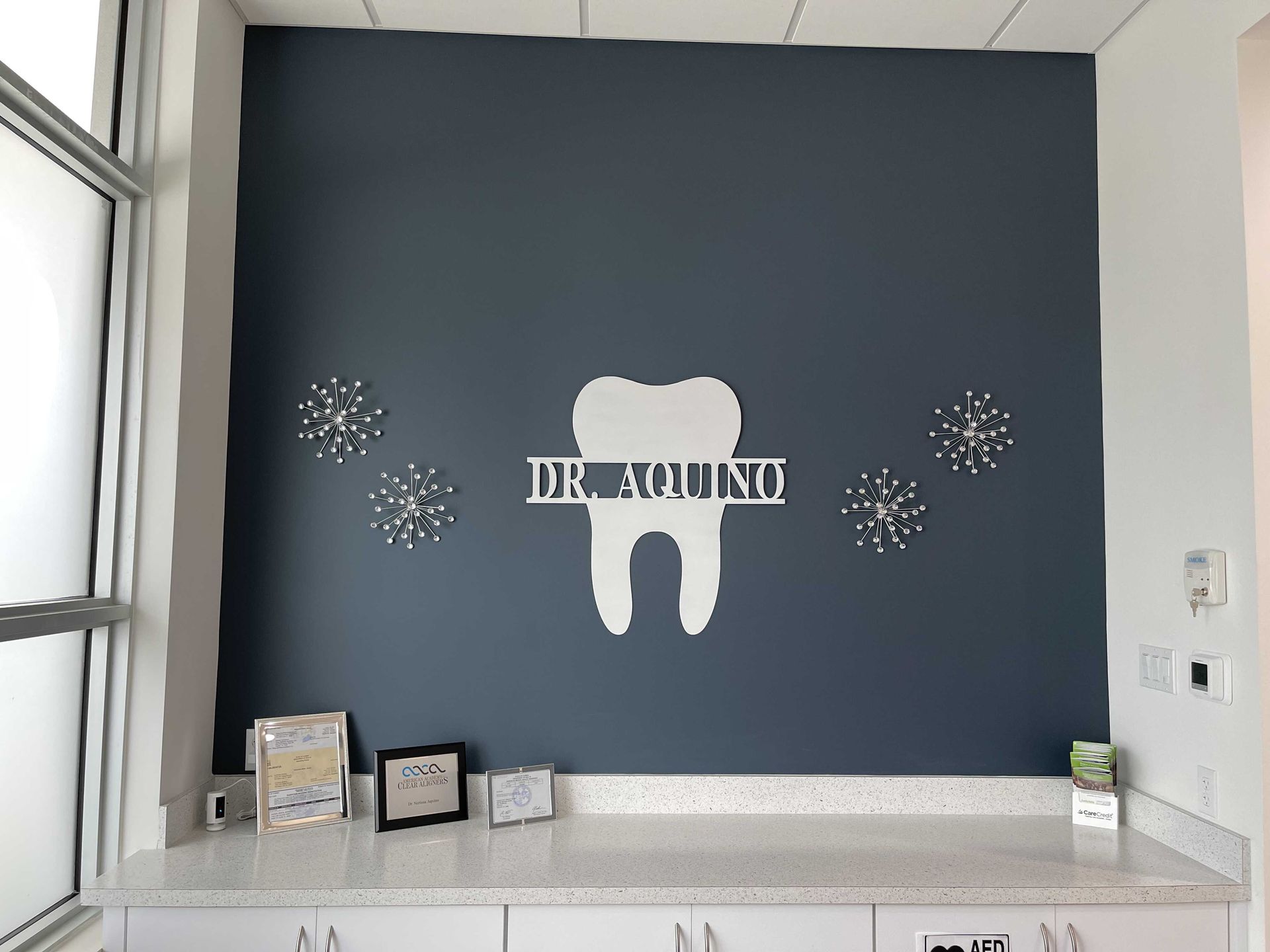 A dental office with a tooth on the wall