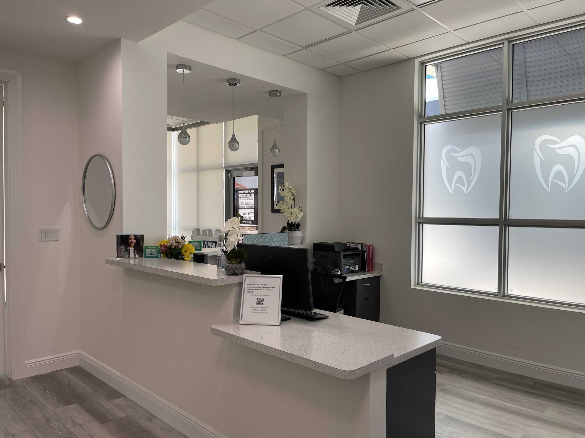 A dental office with a counter and a computer on it.